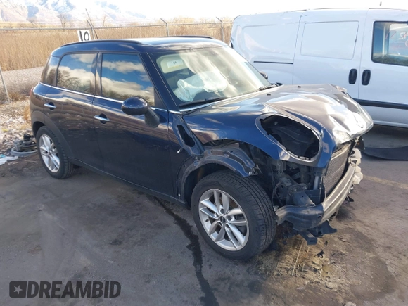 2013 MINI Countryman S with VIN WMWZC3C52DWP21475, listed as a IAAI auction lot 41215334 with 124,365 mi miles and . Bid and sale history available at DreamBid. Image 1.