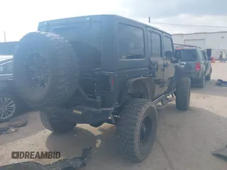 2014 Jeep Wrangler Unlimited Rubicon X with VIN 1C4HJWFG3EL274905, listed as a IAAI auction lot 41512631 with 123,961 mi miles and . Bid and sale history available at DreamBid. Image 4.