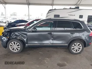 2014 Volkswagen Touareg Sport with VIN WVGEF9BP0ED015273, listed as a IAAI auction lot 42046823 with 84,694 mi miles and . Bid and sale history available at DreamBid. Image 14.