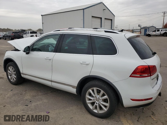 2014 Volkswagen Touareg Sport with VIN WVGEF9BP3ED005921, listed as a Copart auction lot 77372514 with 156,753 mi miles and Salvage Title. Bid and sale history available at DreamBid. Image 2.