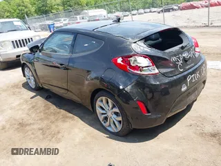 2013 Hyundai Veloster w/Black Int with VIN KMHTC6AD5DU164900, listed as a IAAI auction lot 36770576 with 106,253 mi miles and . Bid and sale history available at DreamBid. Image 3.