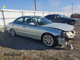 1998 Acura Integra LS with VIN JH4DB7659WS002591, listed as a Copart auction lot 84289584 with 316,458 mi miles and Salvage title. Bid and sale history available at DreamBid. Image 4.