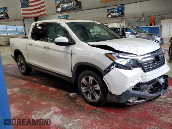 2017 Honda Ridgeline RTL-E with VIN 5FPYK3F72HB002890, listed as a Copart auction lot 57699735 with 128,813 mi miles and Salvage title. Bid and sale history available at DreamBid. Image 4.