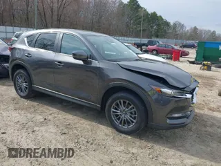 2017 Mazda CX-5 Touring with VIN JM3KFACLXH0125819, listed as a IAAI auction lot 41687038 with 101,769 mi miles. Bid and sale history available at carsss.com. Image 1.