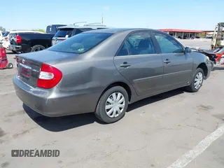 2004 Toyota Camry LE with VIN 4T1BE32K44U825561, listed as a IAAI auction lot 42051914 with 244,521 mi miles and . Bid and sale history available at DreamBid. Image 3.