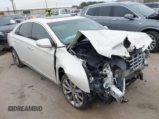 2014 Cadillac XTS Luxury with VIN 2G61M5S35E9303899, listed as a IAAI auction lot 41630891 with 1 mi miles. Bid and sale history available at carsss.com. Image 1.