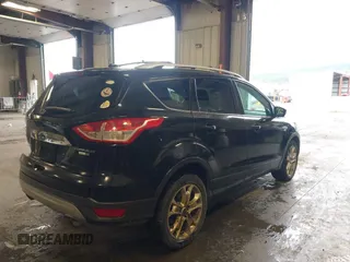 2015 Ford Escape Titanium with VIN 1FMCU9J98FUC70495, listed as a IAAI auction lot 41978543 with 129,974 mi miles. Bid and sale history available at carsss.com. Image 4.