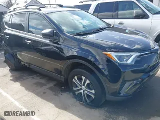 2018 Toyota RAV4 LE with VIN 2T3ZFREV9JW457062, listed as a IAAI auction lot 41696609 with 96,716 mi miles. Bid and sale history available at carsss.com. Image 1.