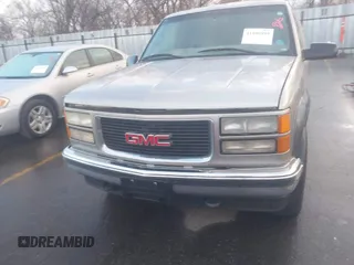 1999 GMC Suburban with VIN 1GKFK16R4XJ799354, listed as a IAAI auction lot 41696999 with 269,606 mi miles. Bid and sale history available at carsss.com. Image 6.