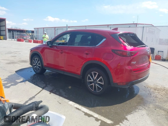 2018 Mazda CX-5 Grand Touring with VIN JM3KFBDM6J0424663, listed as a IAAI auction lot 42003207 with 95,442 mi miles and . Bid and sale history available at DreamBid. Image 3.