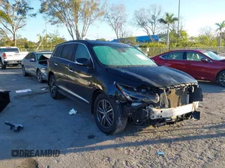 2019 Infiniti QX60 LUXE with VIN 5N1DL0MN0KC548592, listed as a IAAI auction lot 41305876 with 142,064 mi miles. Bid and sale history available at carsss.com. Image 1.
