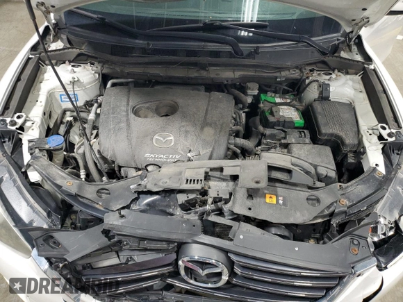2016 Mazda CX-5 Sport with VIN JM3KE4BY9G0694709, listed as a Copart auction lot 55147555 with 98,900 mi miles and Salvage title. Bid and sale history available at DreamBid. Image 12.