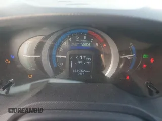 2010 Honda Insight EX with VIN JHMZE2H72AS025427, listed as a Copart auction lot 54983775 with 184,052 mi miles and Salvage Title. Bid and sale history available at DreamBid. Image 9.