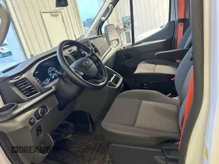 2023 Ford Transit Cargo with VIN 1FTBR1X81PKA75434, listed as a IAAI auction lot 42742887 with 5,111 mi miles and . Bid and sale history available at DreamBid. Image 1.