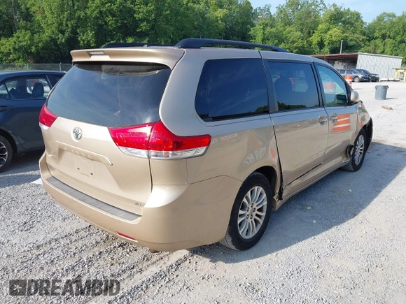 2011 Toyota Sienna XLE AAS with VIN 5TDYK3DC7BS008535, listed as a IAAI auction lot 42589645 with 208,624 mi miles and . Bid and sale history available at DreamBid. Image 4.