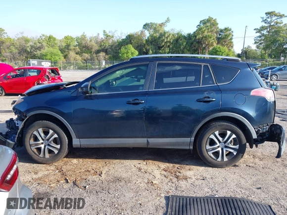 2018 Toyota RAV4 LE with VIN JTMZFREV1JJ203943, listed as a IAAI auction lot 41921863 with 104,691 mi miles. Bid and sale history available at carsss.com. Image 14.