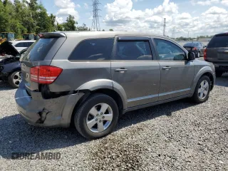 2013 Dodge Journey American Value with VIN 3C4PDCAB8DT566999, listed as a Copart auction lot 61361315 with 183,897 mi miles and Salvage title. Bid and sale history available at DreamBid. Image 3.