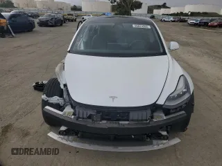 2019 Tesla Model 3 Mid Range with VIN 5YJ3E1EA8KF412886, listed as a Copart auction lot 50824565 with 54,803 mi miles and Salvage Title. Bid and sale history available at carsss.com. Image 5.