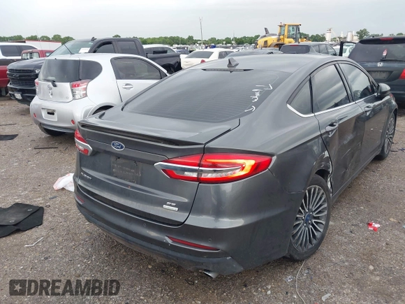 2020 Ford Fusion SE z VIN 3FA6P0HD5LR198744, wystawiony jako IAAI lot #42177820 z przebiegiem 97 520 mil mil oraz . Historia ofert i sprzedaży dostępna na DreamBid. Obrazek 4.