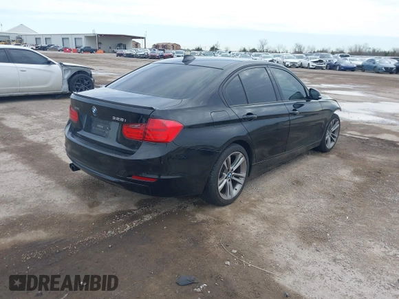 2014 BMW 3 Series 328i xDrive with VIN WBA3B3G57ENR82319, listed as a IAAI auction lot 41655950 with 130,926 mi miles. Bid and sale history available at carsss.com. Image 4.