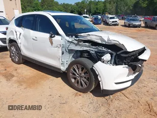 2021 Mazda CX-5 Grand Touring with VIN JM3KFBDM3M0493752, listed as a IAAI auction lot 42456854 with 35,122 mi miles and . Bid and sale history available at DreamBid. Image 1.