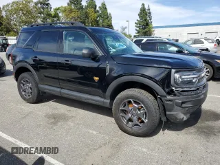 2023 Ford Bronco Sport Badlands z VIN 3FMCR9D97PRD35830, wystawiony jako Copart lot #56950865 z przebiegiem 7 401 mil mil oraz Szkoda całkowita • Salvage title. Historia ofert i sprzedaży dostępna na DreamBid. Obrazek 4.