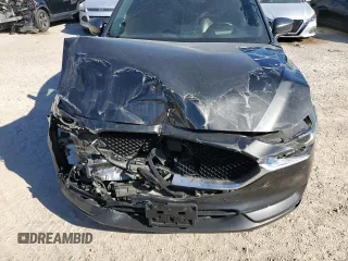 2021 Mazda CX-5 Signature with VIN JM3KFBEY2M0437304, listed as a Copart auction lot 88841415 with 57,100 mi miles and Salvage Title. Bid and sale history available at carsss.com. Image 12.