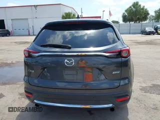 2016 Mazda CX-9 Signature with VIN JM3TCBEY9G0100579, listed as a IAAI auction lot 42282293 with 142,700 mi miles and . Bid and sale history available at DreamBid. Image 16.