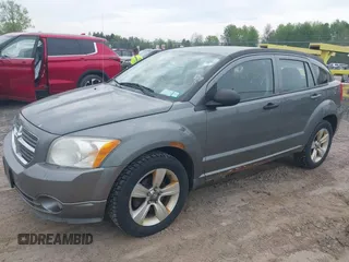 2012 Dodge Caliber SXT with VIN 1C3CDWDA5CD534457, listed as a IAAI auction lot 42197032 with 170,739 mi miles and . Bid and sale history available at DreamBid. Image 2.