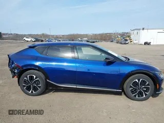 2022 Kia EV6 Wind z VIN KNDC3DLCXN5068642, wystawiony jako IAAI lot #41774075 z przebiegiem 17 632 mil mil oraz . Historia ofert i sprzedaży dostępna na DreamBid. Obrazek 14.