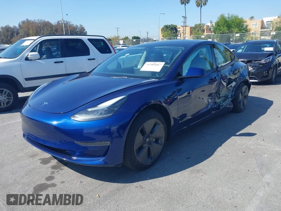 2023 Tesla Model 3 with VIN 5YJ3E1EA1PF431190, listed as a IAAI auction lot 41980007 with 26,164 mi miles and . Bid and sale history available at DreamBid. Image 2.