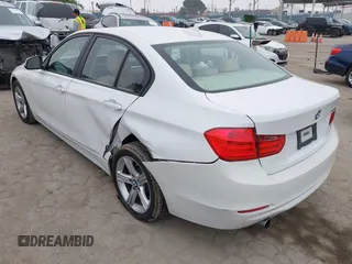 2014 BMW 3 Series 320i with VIN WBA3B1G58ENS80160, listed as a IAAI auction lot 42029951 with 97,306 mi miles. Bid and sale history available at carsss.com. Image 3.