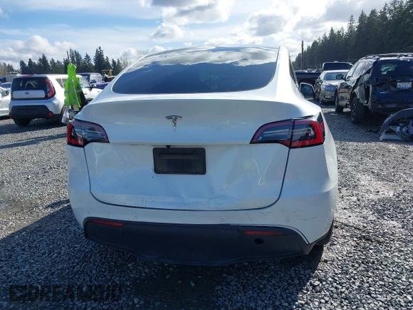 2021 Tesla Model Y Standard Range with VIN 5YJYGDED9MF110697, listed as a IAAI auction lot 41707730 with Not Provided miles and . Bid and sale history available at carsss.com. Image 16.