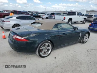 2007 Jaguar XK with VIN SAJWA44C779B12243, listed as a Copart auction lot 77239534 with 0 mi miles and Salvage Title. Bid and sale history available at carsss.com. Image 3.