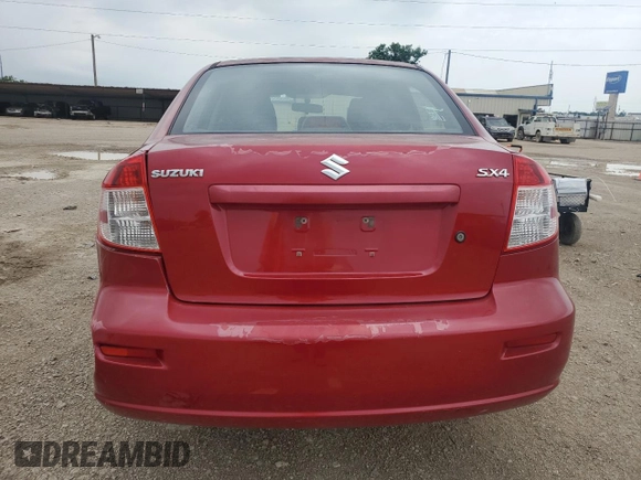 2012 Suzuki SX4 LE z VIN JS2YC5A33C6304897, wystawiony jako Copart lot #55567505 z przebiegiem 42 968 mil mil oraz Szkoda całkowita • Salvage title. Historia ofert i sprzedaży dostępna na DreamBid. Obrazek 6.
