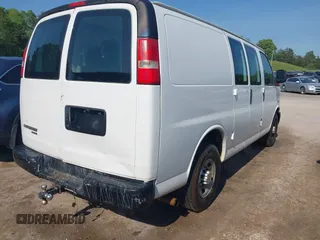 2014 Chevrolet Express Cargo Van with VIN 1GCWGFCG0E1100859, listed as a IAAI auction lot 42142748 with 182,900 mi miles. Bid and sale history available at carsss.com. Image 4.