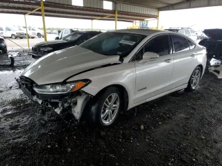 2016 Ford Fusion Titanium Hybrid with VIN 3FA6P0RUXGR314220, listed as a Copart auction lot 61512404 with 152,067 mi miles and Salvage Title. Bid and sale history available at carsss.com. Image 1.