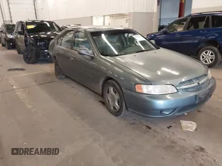 2000 Nissan Altima XE with VIN 1N4DL01D4YC185986, listed as a IAAI auction lot 41831774 with 217,044 mi miles. Bid and sale history available at carsss.com. Image 1.