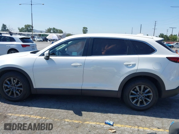 2020 Mazda CX-9 Sport with VIN JM3TCABY1L0406720, listed as a IAAI auction lot 42304144 with 75,887 mi miles and . Bid and sale history available at DreamBid. Image 14.