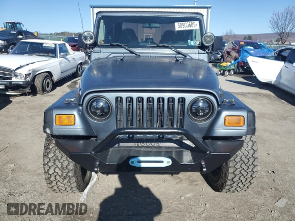 2002 Jeep Wrangler Sport with VIN 1J4FA49S22P703610, listed as a Copart auction lot 50900605 with 70,045 mi miles and Salvage Title. Bid and sale history available at carsss.com. Image 5.