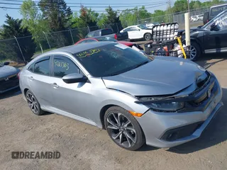 2019 Honda Civic Sport with VIN 2HGFC2F81KH535381, listed as a IAAI auction lot 42163363 with 74,096 mi miles and . Bid and sale history available at DreamBid. Image 1.