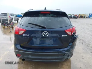 2015 Mazda CX-5 Touring with VIN JM3KE2CY5F0449195, listed as a IAAI auction lot 41894567 with 124,694 mi miles and . Bid and sale history available at DreamBid. Image 16.