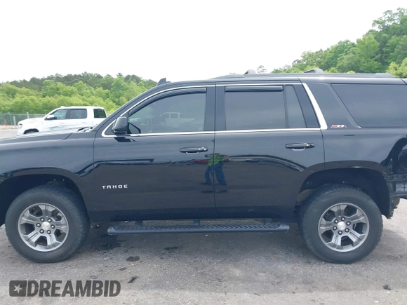 2017 Chevrolet Tahoe LT z VIN 1GNSKBKC8HR311969, wystawiony jako IAAI lot #42126414 z przebiegiem 160 994 mil mil oraz . Historia ofert i sprzedaży dostępna na DreamBid. Obrazek 14.