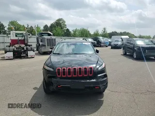 2014 Jeep Cherokee Trailhawk with VIN 1C4PJMBSXEW187981, listed as a Copart auction lot 56711885 with 157,317 mi miles and Salvage title. Bid and sale history available at DreamBid. Image 14.