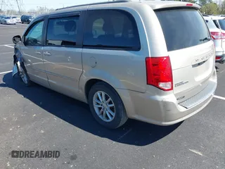 2013 Dodge Grand Caravan SXT with VIN 2C4RDGCGXDR635008, listed as a IAAI auction lot 41859146 with 133,119 mi miles and . Bid and sale history available at DreamBid. Image 3.