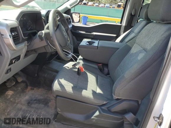 2023 Ford F-150 XL with VIN 1FTFW1E89PKD98613, listed as a Copart auction lot 61860785 with 25,568 mi miles and Salvage title. Bid and sale history available at DreamBid. Image 7.