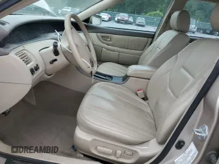 2003 Toyota Avalon XL z VIN 4T1BF28BX3U321934, wystawiony jako Copart lot #59497525 z przebiegiem 107 405 mil mil oraz Szkoda całkowita • Salvage title. Historia ofert i sprzedaży dostępna na DreamBid. Obrazek 7.