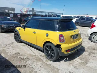 2009 MINI Hardtop S with VIN WMWMF73579TW86675, listed as a IAAI auction lot 42459385 with 129,264 mi miles and . Bid and sale history available at DreamBid. Image 3.
