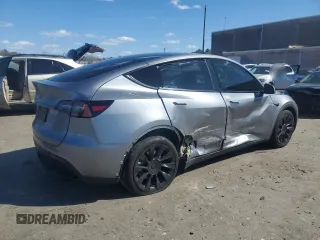2025 Tesla Model Y Long Range with VIN 7SAYGDED0SF247561, listed as a Copart auction lot 50736875 with 9,094 mi miles and Salvage Title. Bid and sale history available at DreamBid. Image 3.