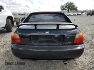 1997 Honda del Sol Si with VIN JHMEH6263VS001799, listed as a Copart auction lot 73735194 with 52,448 mi miles and Salvage Title. Bid and sale history available at carsss.com. Image 6.